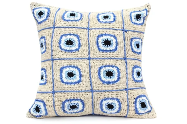 "Gaze into Serenity: Crochet Cushion with Blue Eyes"