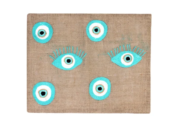 "Eyes That Sparkle: Hand-Embroidered Burlap Placemat"